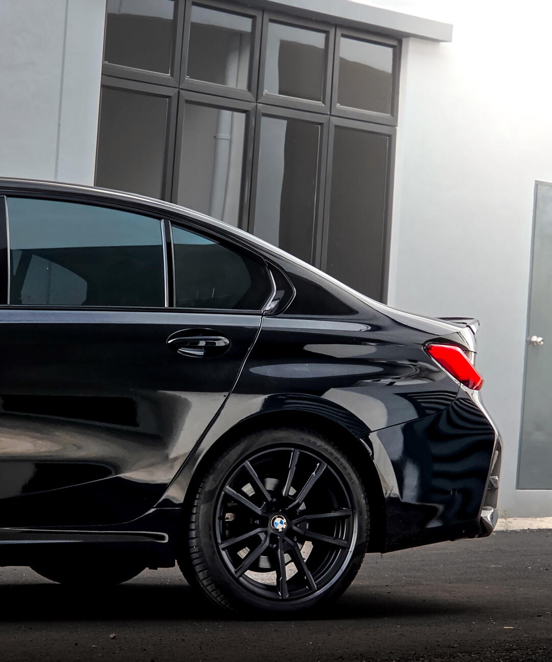 Completed black BMW G20 conversion from the rear side