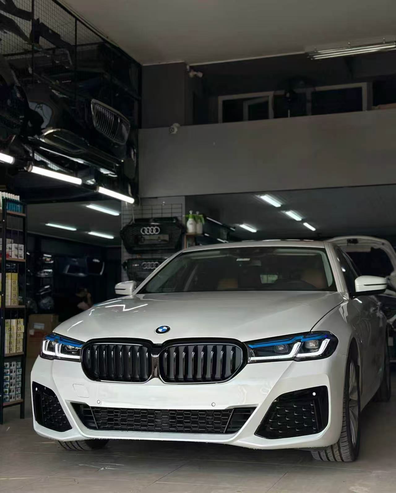 White BMW G30 after its LCI M-Tech-style front conversion